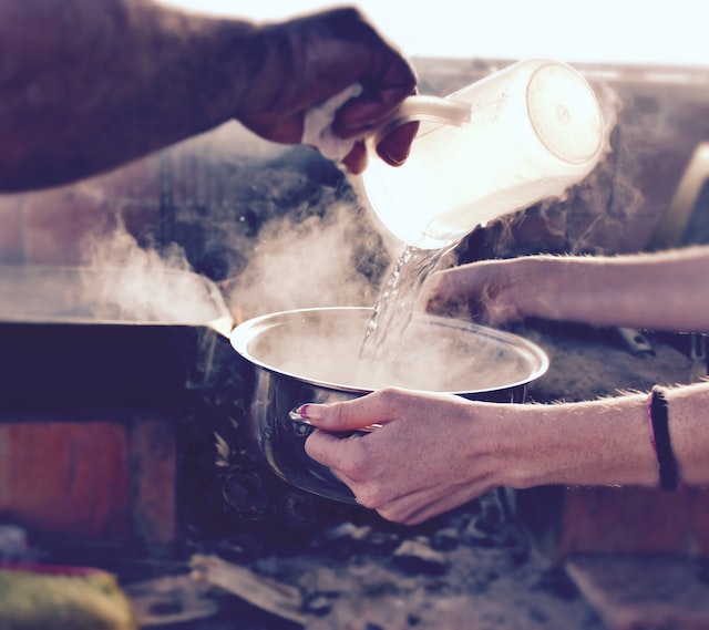 Pouring hot water into a bowl